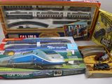 un circuit de train miniature dans une boîte sur laquelle est représenté un train