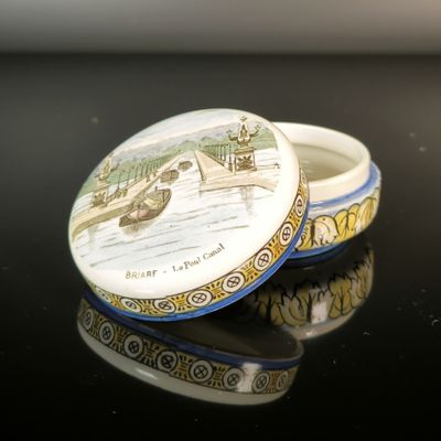 a small box with a picture on it sitting on a table