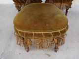 two chairs with fringes on them sitting on the floor