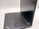 a laptop computer sitting on a table with a keyboard