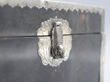 a close up of a metal box with a fish on it