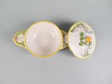 two yellow and white cups with flowers on them