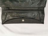 black leather purse on white background with white background
