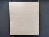 a white piece of paper hanging on the wall