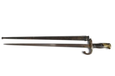 pair of two old fashioned swords on a white surface with a white background