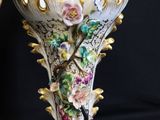 two vases that have been decorated with flowers on them
