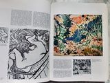 an open book with a picture of a woman in a garden