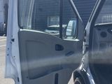 the door of a truck with the door open and the driver ' s side door open