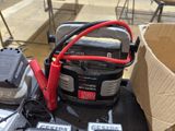 two batteries and a charger on the back of a motorcycle