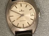 a close up of a wrist watch on a table