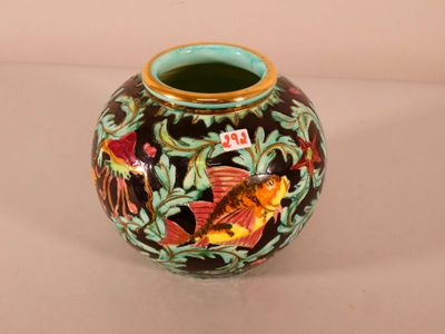 a vase with a design on it sitting on a table