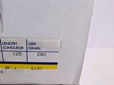 a stack of boxes with labels on them on a table