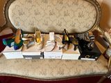 many pairs of shoes sitting on a chair next to each other