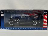 an old model car in a box with an american flag on it