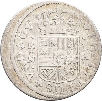 a silver coin with a coat of arms on it
