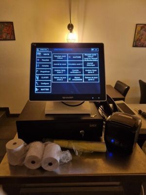 a desktop computer sitting on top of a wooden desk