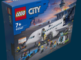 a box of lego city set with a plane on the tarmac