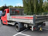 a red truck that is parked in a parking lot