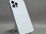a white iphone sitting on top of a metal stand