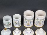 several cups and saucers are sitting next to each other on a table