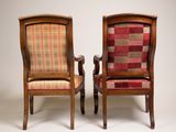 two wooden chairs with plaid upholstered seats and arms