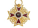 une image représentant une médaille d'or ornée d'une étoile rouge