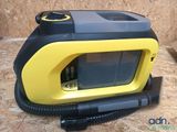 a yellow and black device that is sitting on a table