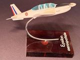 a small model of a small airplane on a stand