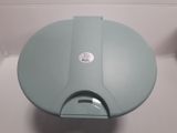 a blue toilet that has a blue lid and a silver lid