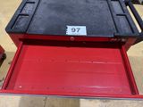 a close up of a red tool box with a number on it
