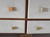four drawers that have different colored magnets on them