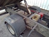 a truck that has a big tire on the back of it