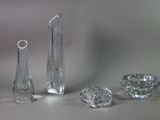 several pieces of glass sitting on a table next to each other