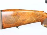 the rifle is mounted on the wall and ready to be used