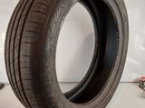 a close up of a tire on a white surface with a white background