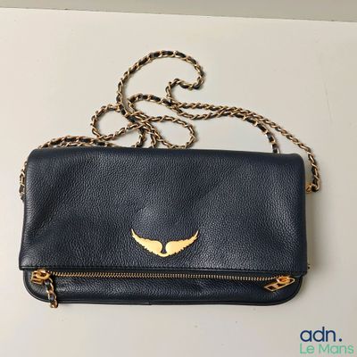 a black purse with a gold heart on it