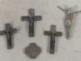 three crosses and a crucif cross on a white surface