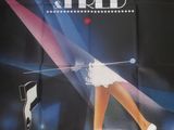poster advertising a concert for a singer in a high heeled shoe