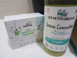 a bottle of liquid sitting next to a box of soap