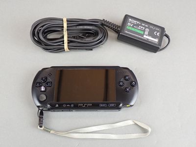 a game controller and a charger on a table