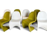 four chairs are arranged in a row on a white surface