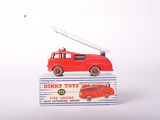 a red toy fire truck with a ladder on top of it