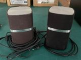 two speakers that are sitting on a table