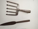 two forks and a fork on a white surface