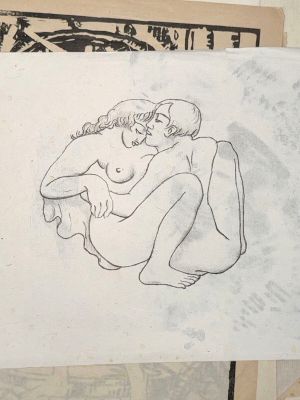 a drawing of a nude woman sitting on top of a piece of paper