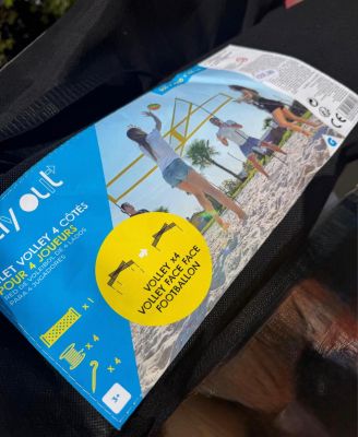 a bag that has a sticker on it with a picture of people on the beach