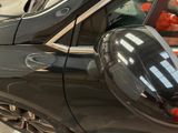 an image of a car with a mirror on the side of it