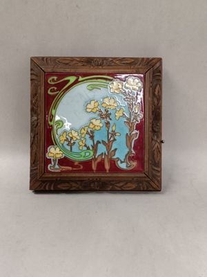 a close up of a picture of a picture of flowers on a wall