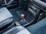 a car dashboard with a gear box and a steering wheel
