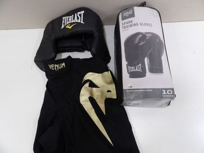 a pair of boxing gloves and a box on a table